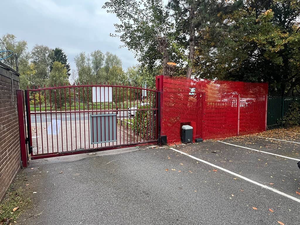 Secure red gate with integrated access control at Meridian Integrated Systems.