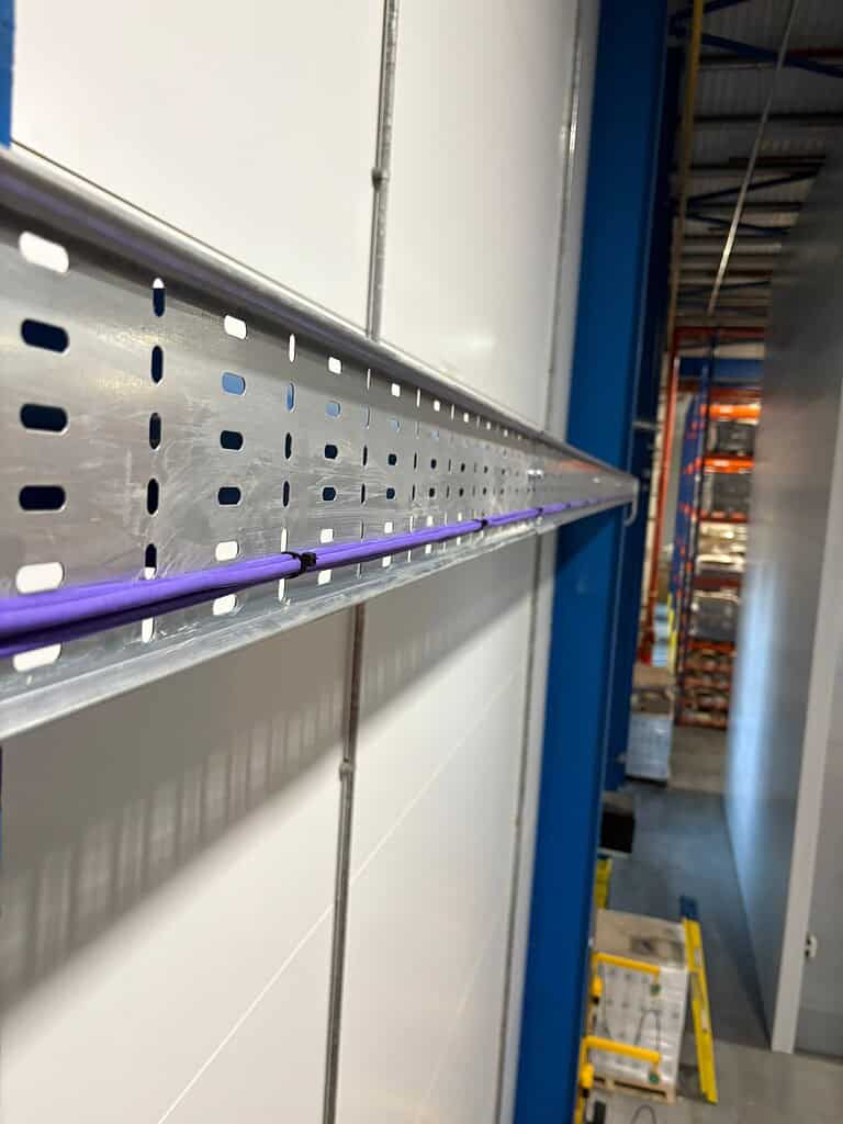 Cable management system installed in data centre for efficient wiring and organisation.