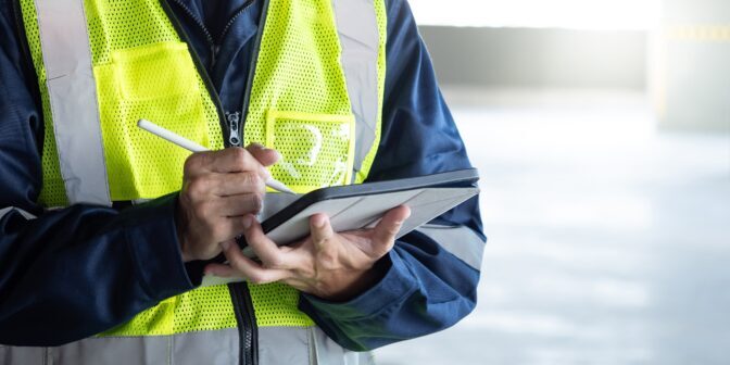Site inspection by Meridian Integrated Systems technician using a tablet.